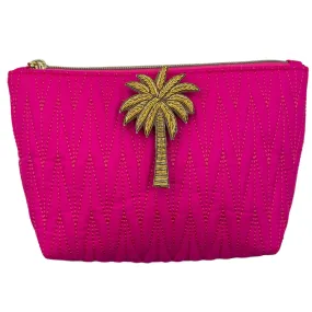 Bright pink Tribeca make up bag with palm tree pin